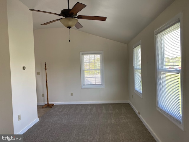 carpeted spare room with vaulted ceiling and ceiling fan