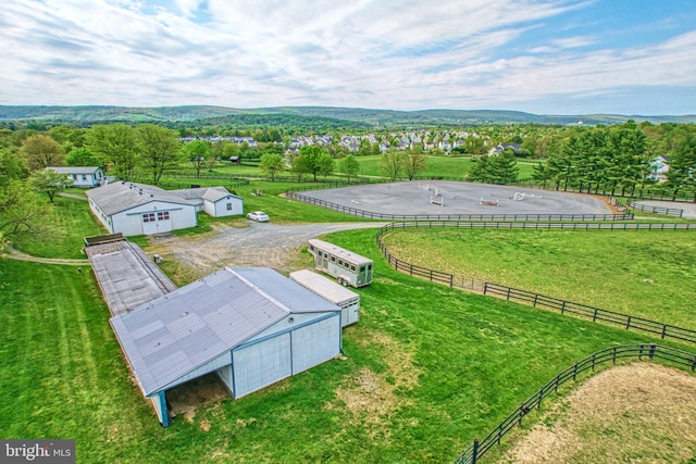 birds eye view of property featuring a rural view