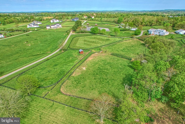 birds eye view of property featuring a rural view