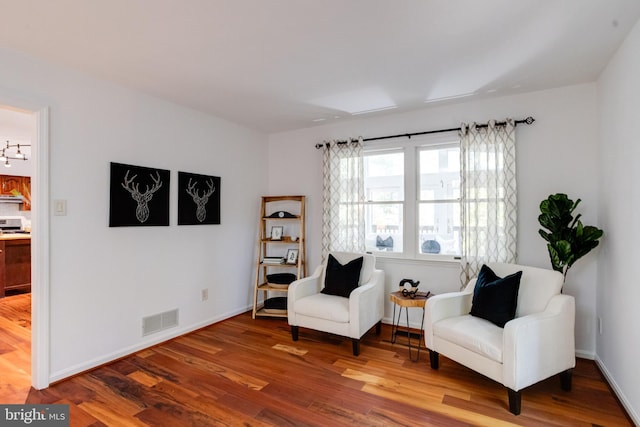 sitting room featuring wood-type flooring