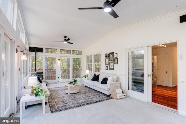 sunroom / solarium featuring vaulted ceiling and ceiling fan