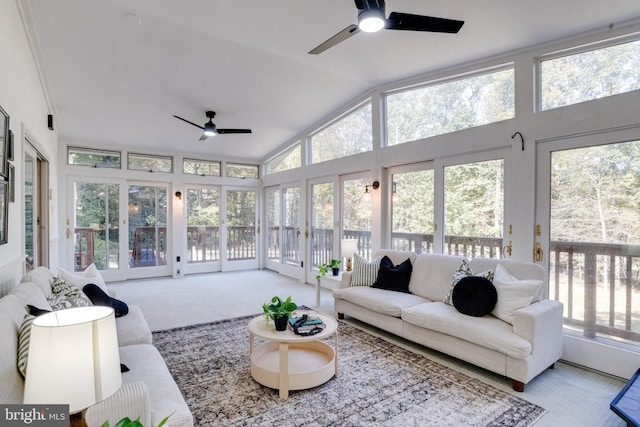 sunroom with plenty of natural light, ceiling fan, and vaulted ceiling