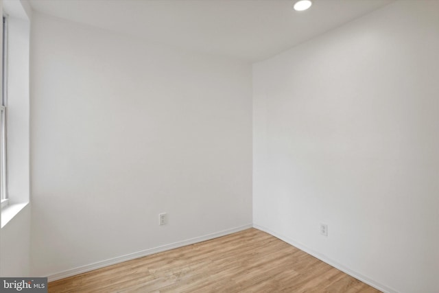 unfurnished room featuring light hardwood / wood-style flooring