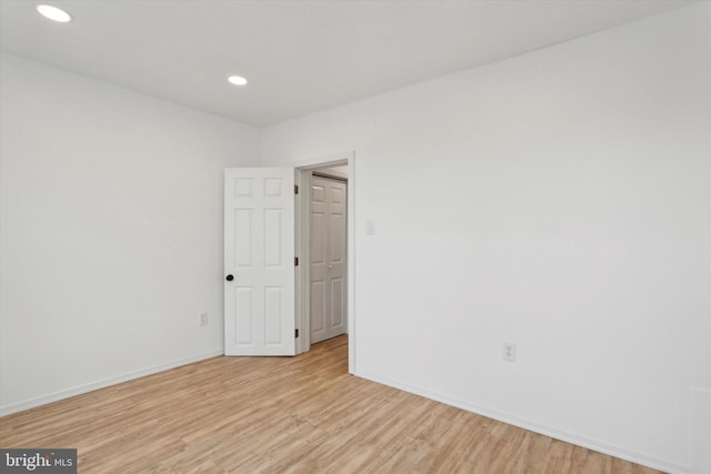 empty room with light hardwood / wood-style floors