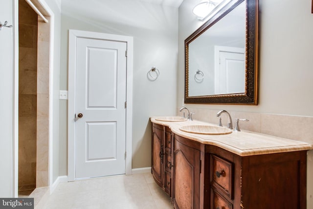 bathroom with vanity and tile patterned flooring