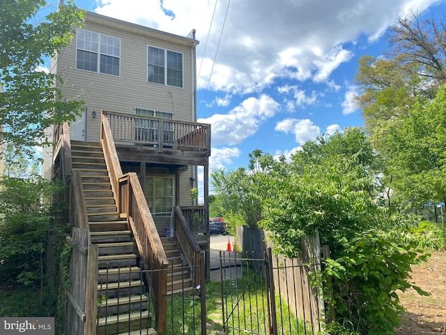 back of house with a balcony