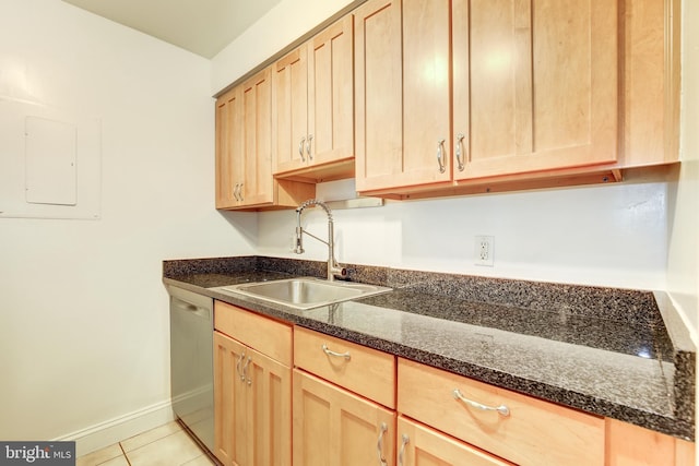 kitchen with light brown cabinetry, sink, dishwasher, light tile flooring, and dark stone counters