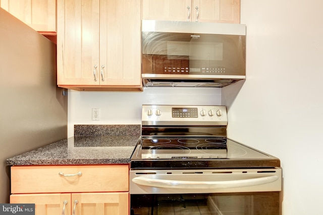 kitchen featuring appliances with stainless steel finishes and light brown cabinets