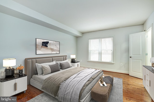 bedroom with wood-type flooring