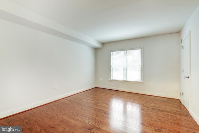 unfurnished room featuring light wood-type flooring