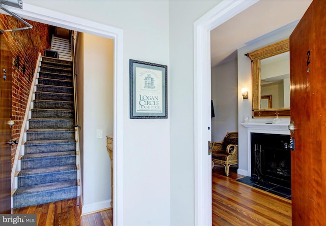 hallway with dark wood-type flooring