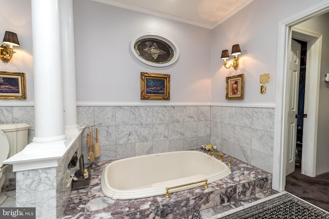 bathroom featuring crown molding, ornate columns, tiled tub, tile floors, and toilet