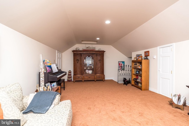 interior space with carpet and lofted ceiling