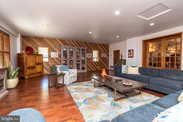 living room featuring wood walls and wood-type flooring