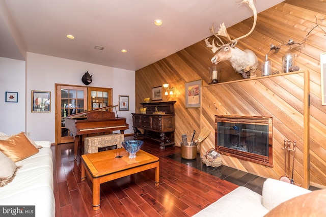 living room featuring wooden walls and wood-type flooring