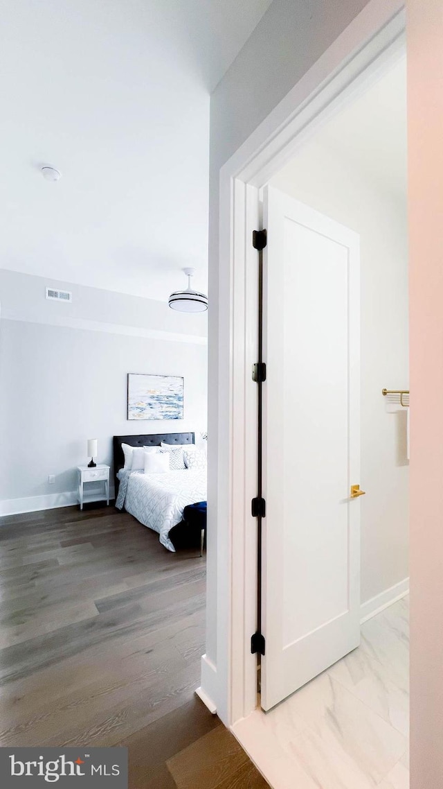 hallway with wood-type flooring