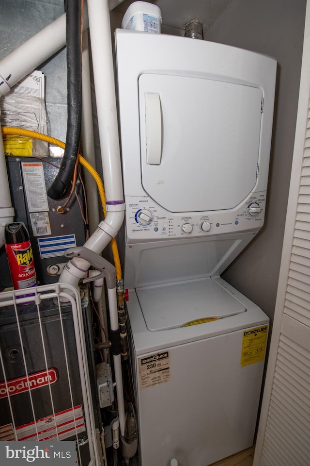 washroom with stacked washer and clothes dryer