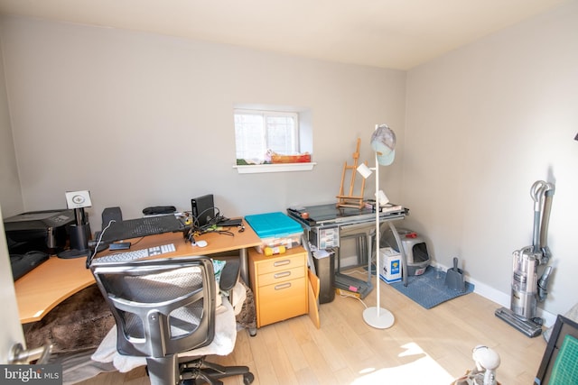 office area with light hardwood / wood-style floors