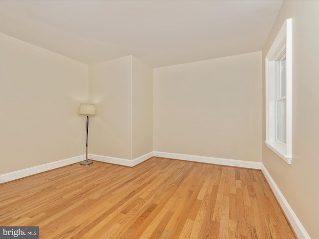 spare room featuring light wood-type flooring