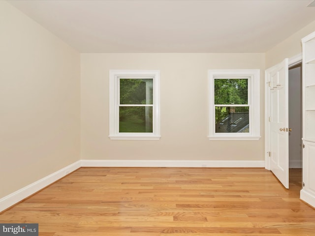 empty room with light wood-type flooring