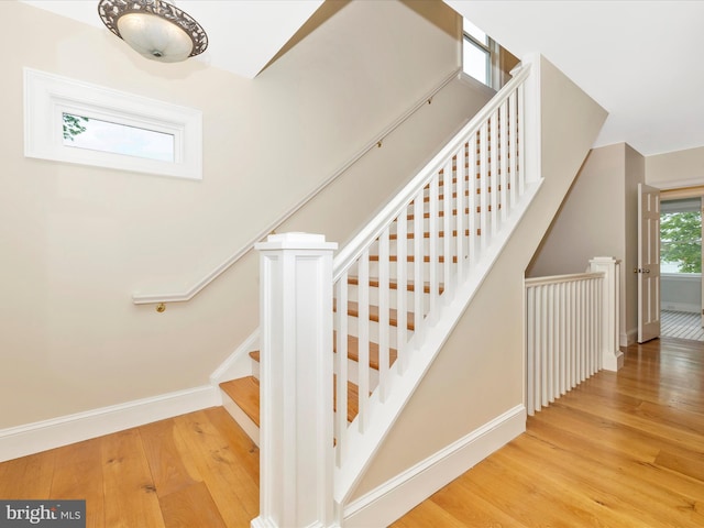 staircase with light wood-type flooring