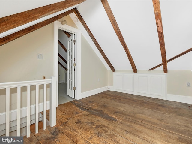 additional living space featuring dark hardwood / wood-style floors and vaulted ceiling