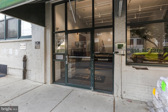 property entrance with a patio area