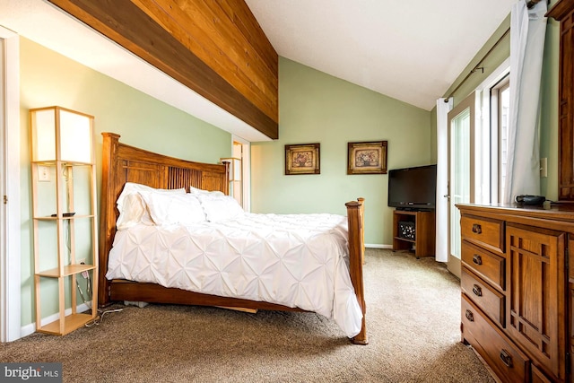 bedroom with lofted ceiling and carpet flooring