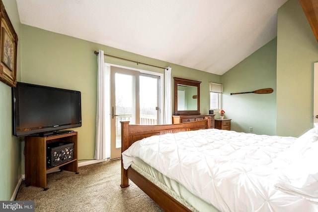 carpeted bedroom featuring vaulted ceiling