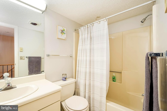 full bathroom with a textured ceiling, shower / tub combo, toilet, and vanity