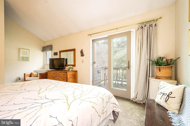 bedroom featuring vaulted ceiling, access to exterior, and carpet floors