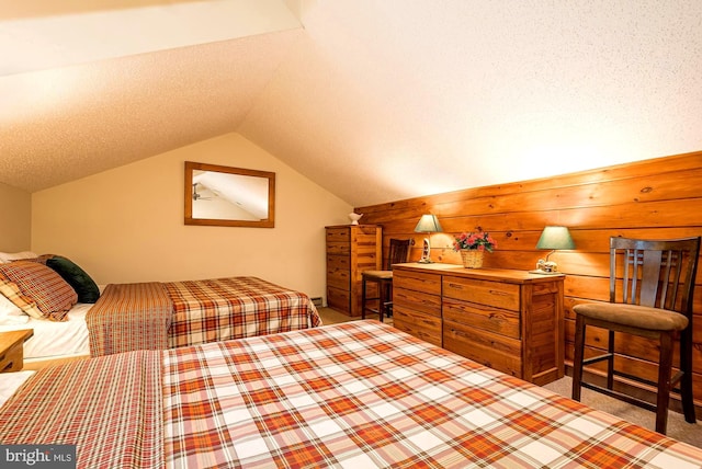 carpeted bedroom with lofted ceiling and a textured ceiling