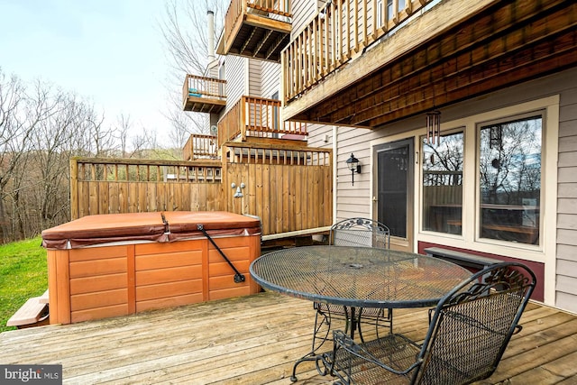 deck featuring a hot tub