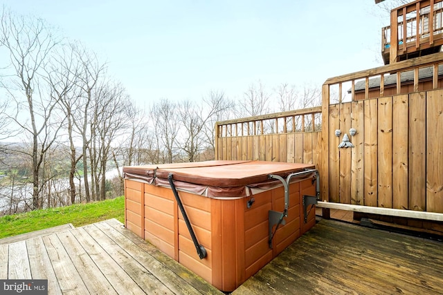 wooden terrace with a hot tub