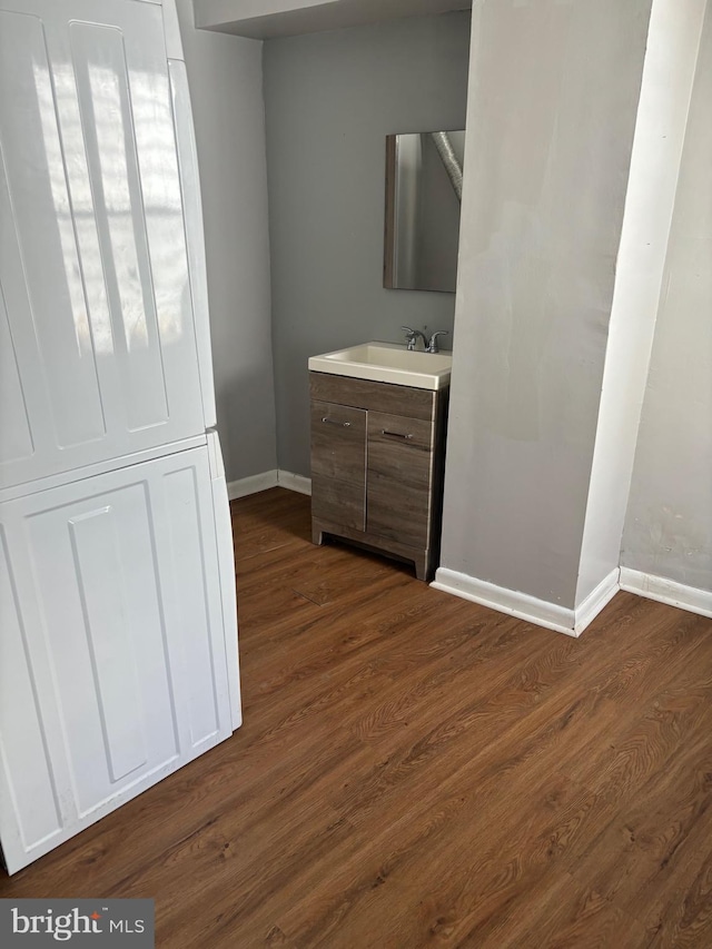 bathroom with hardwood / wood-style floors and vanity