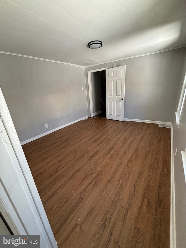 unfurnished bedroom with wood-type flooring