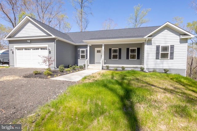 ranch-style house with a garage, a porch, and a front yard