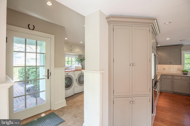 interior space with light hardwood / wood-style flooring and separate washer and dryer