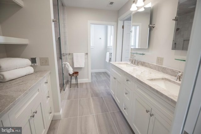 bathroom featuring tile floors and dual bowl vanity