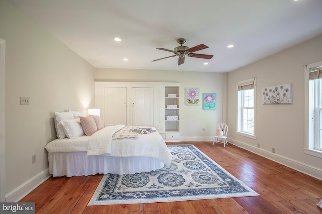 bedroom featuring ceiling fan and hardwood / wood-style flooring