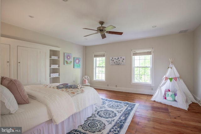 bedroom featuring ceiling fan and hardwood / wood-style flooring