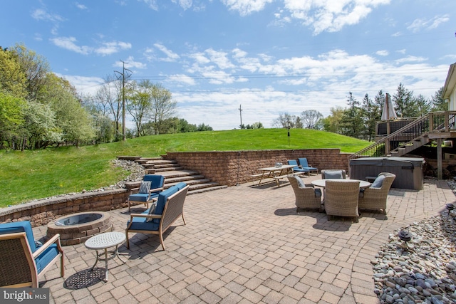 view of patio / terrace featuring an outdoor living space with a fire pit