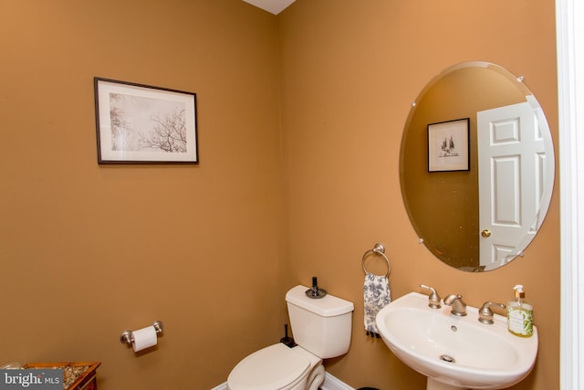 bathroom with sink and toilet