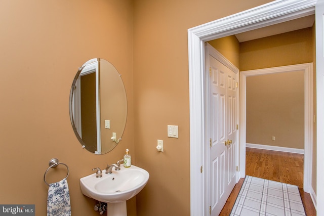 bathroom with sink and hardwood / wood-style floors