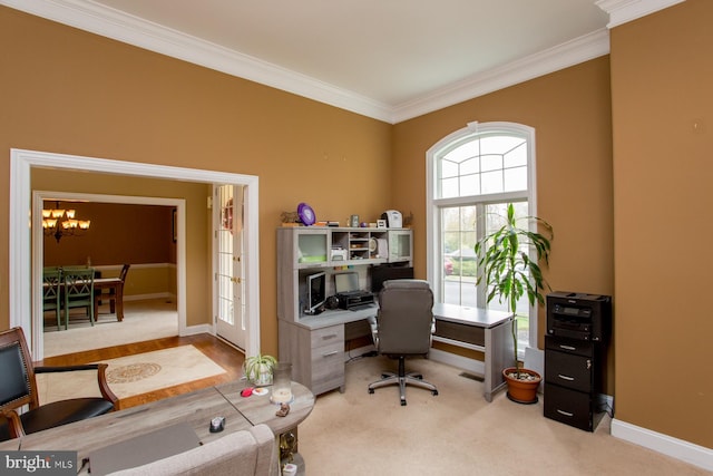 home office featuring light carpet, a chandelier, and ornamental molding