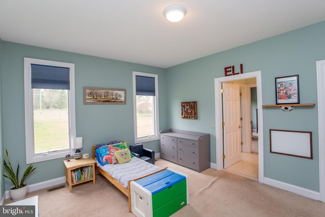 bedroom with light carpet