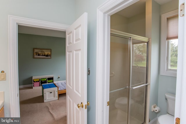 bathroom with vanity, toilet, and walk in shower