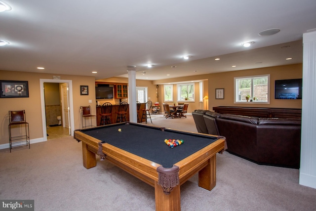 recreation room featuring pool table, light colored carpet, and bar