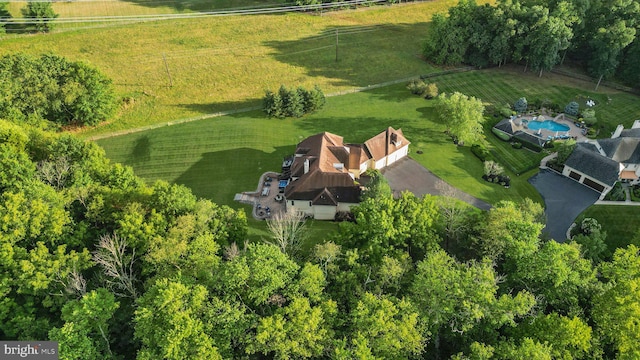 birds eye view of property with a rural view