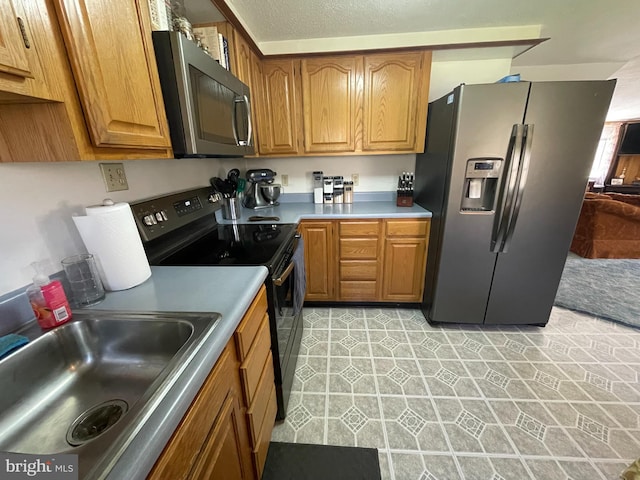 kitchen featuring appliances with stainless steel finishes and sink